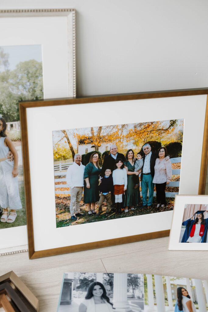 A picture of a framed wall art piece of a group family taken by Captured by Brooke, a Raleigh family photographer